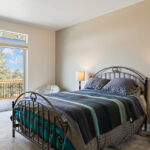 Home Plan 2248 primary bedroom with sliding doors to deck upgraded.