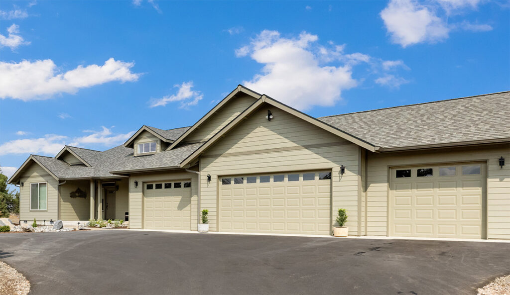 Exterior of Home Plan 2248 with added garage bay.