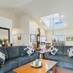 Home Plan 2248 living room to dining room with back dormer window.