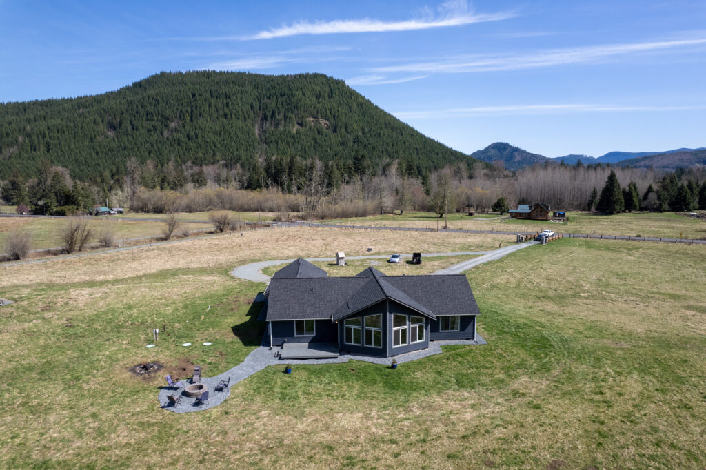 Aerial view of Home Plan 2041 with mountains in the background.