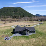 Aerial view of Home Plan 2041 with mountains in the background.