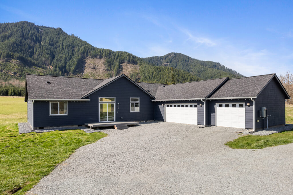 The exterior of Home Plan 2041 showing an additional garage bay added.