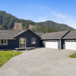 The exterior of Home Plan 2041 showing an additional garage bay added.