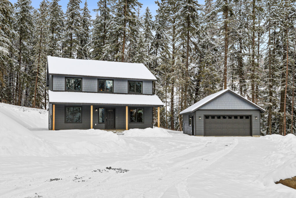 Home Plan 1768 front exterior with detached garage.