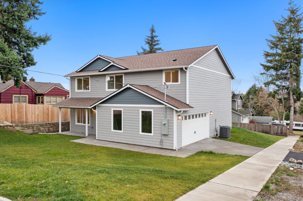 Home Plan 2373 front exterior with side garage.