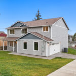 Home Plan 2373 front exterior with side garage.