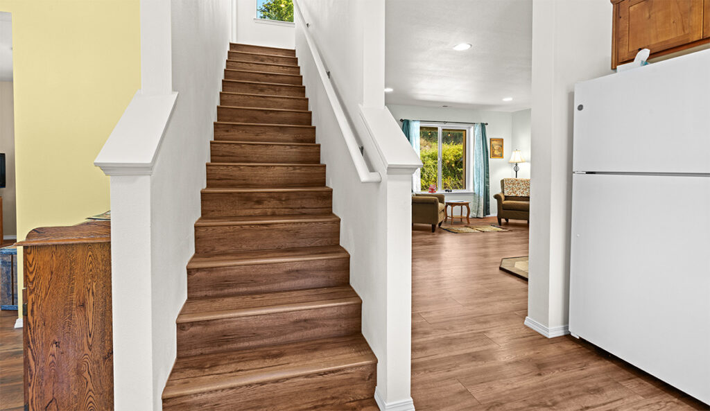 Upgraded stairs from carpet to vinyl in home plan 1768.