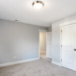 Additional bedroom showing closets.