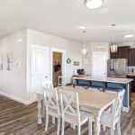 Kitchen and Dining to Foyer in home plan 3072.