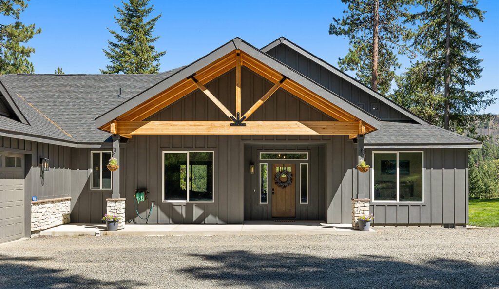 Exterior timber frame covered porch of home plan 3295.