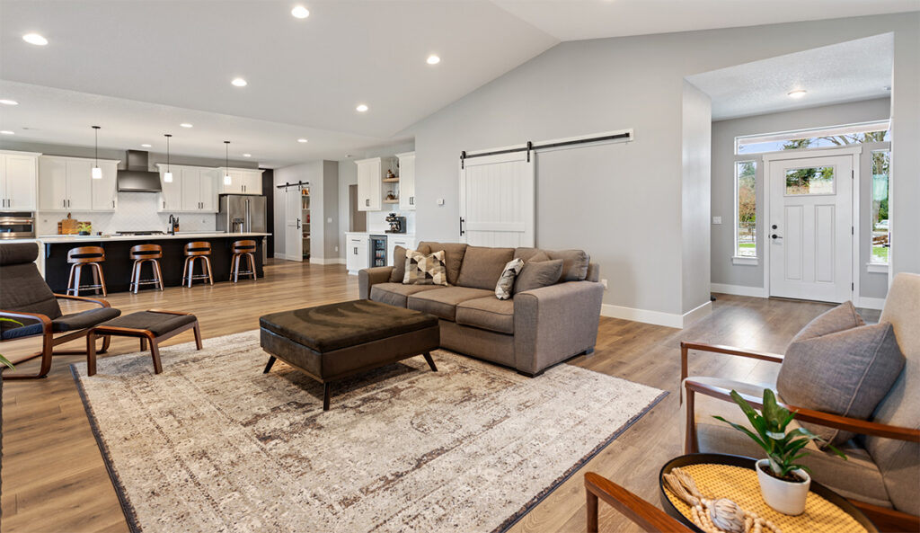 Open floor concept from living room to kitchen, showing bonus room access.
