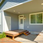 Home Plan 800 back exterior outdoor living space covered porch and storage.