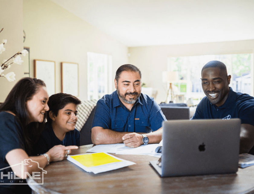 HiLine Homes Consultant helping a family choose their home plan.