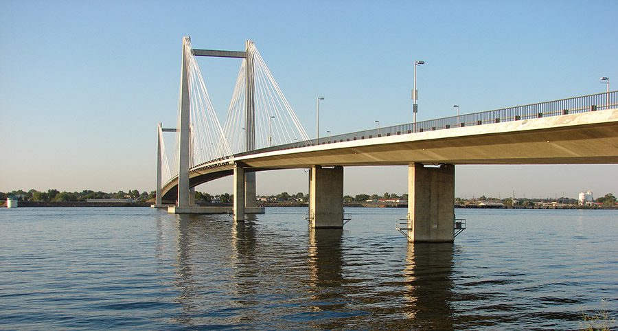 Cable Bridge over Columbia river with sage brush in foreground,