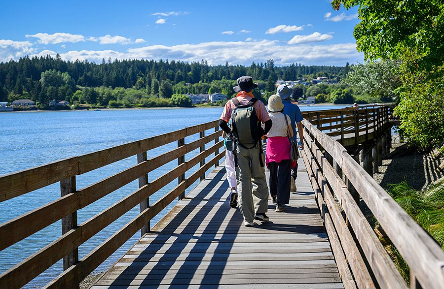 People walking on the bridge in Poulsbo. Poulsbo is a city on Liberty Bay in Kitsap County, Washington State.