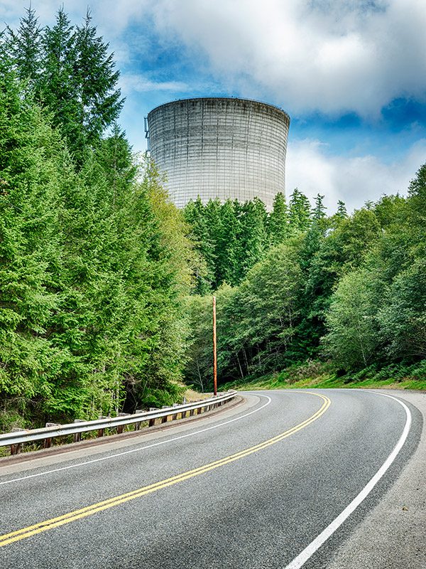 A highway leads to one of the large cooling towers at the WPPS nuclear reactor facility near Elma, Washington.
