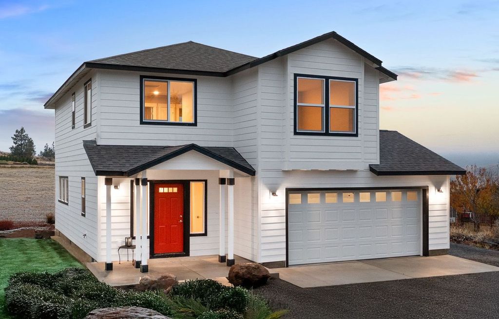 Home plan 1675 exterior with added garage space.