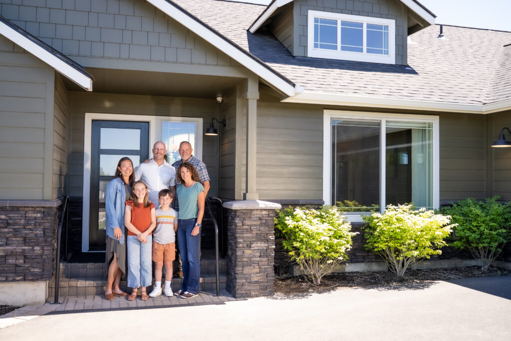 Family in front of a HiLine home.